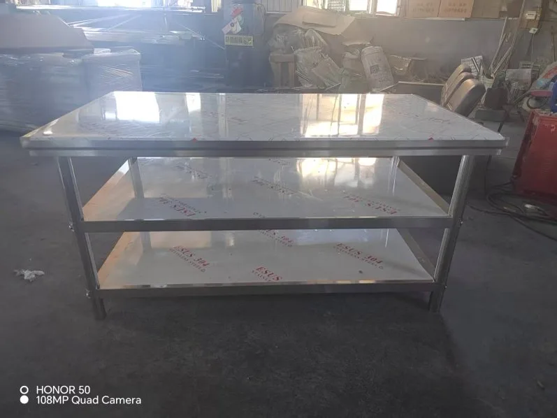 Three-tier work table viewed in production bay