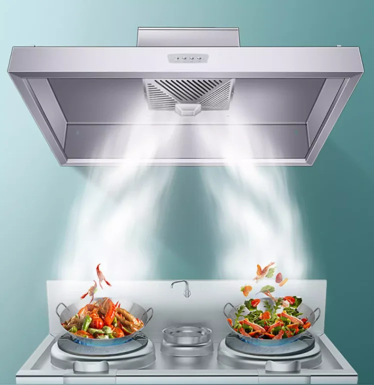 Commercial stainless steel kitchen exhaust hood over cooking range with steam capture