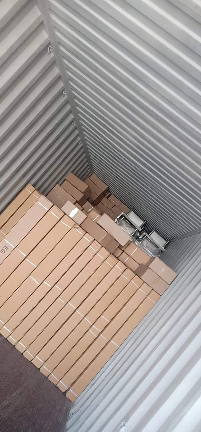 Stainless steel shelving loaded into export container