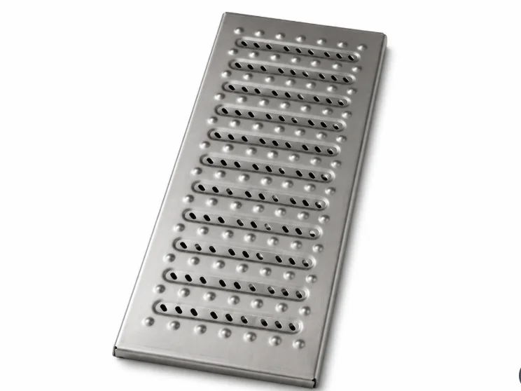 Stainless steel trench drain grate with slot and stud pattern