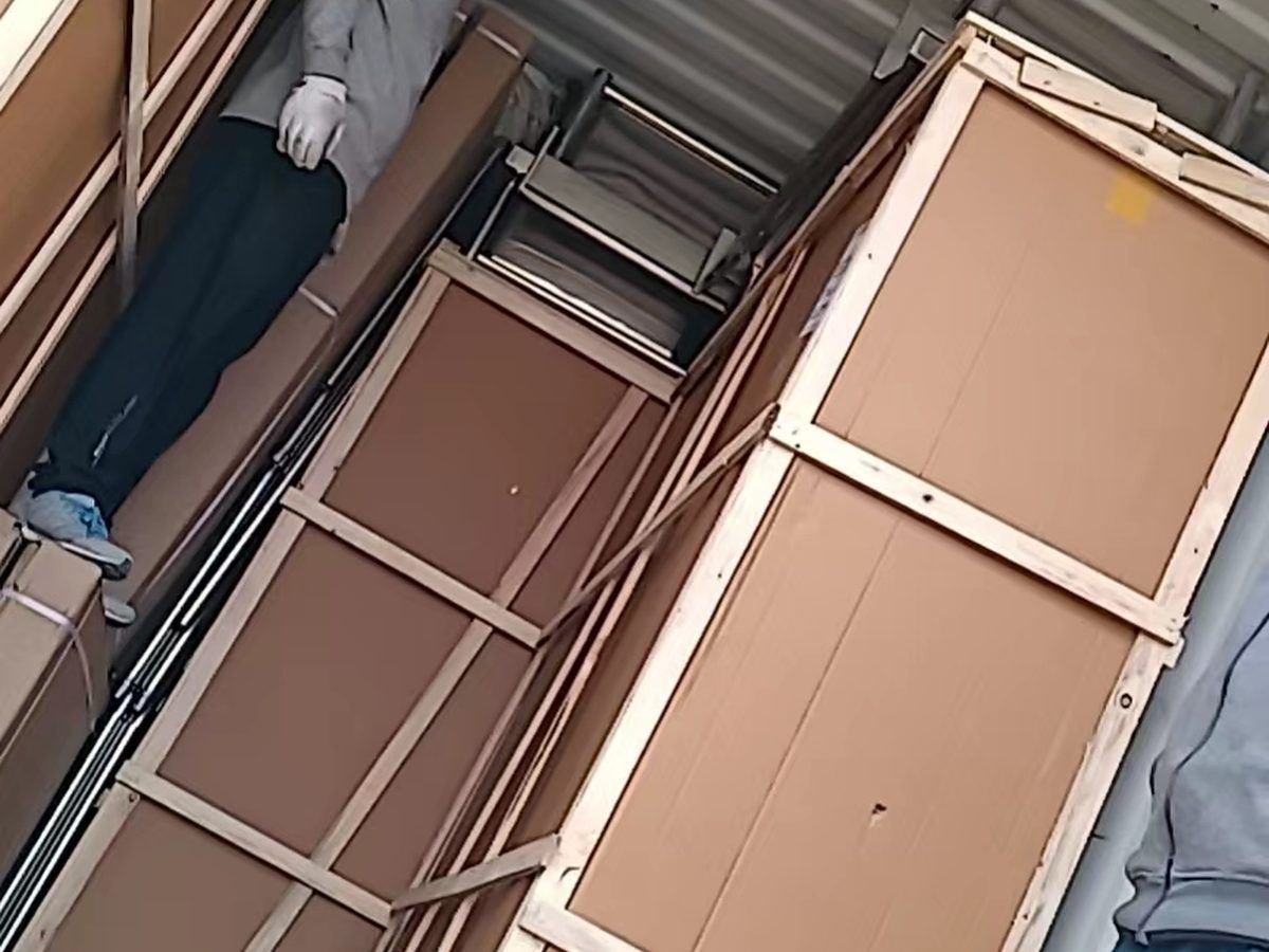 Container fully loaded with rice steamer crates