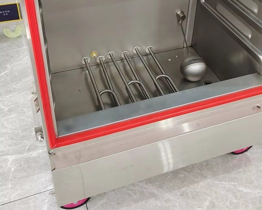 Stainless steel interior of Full Kitchen rice steamer showing heating elements and seal
