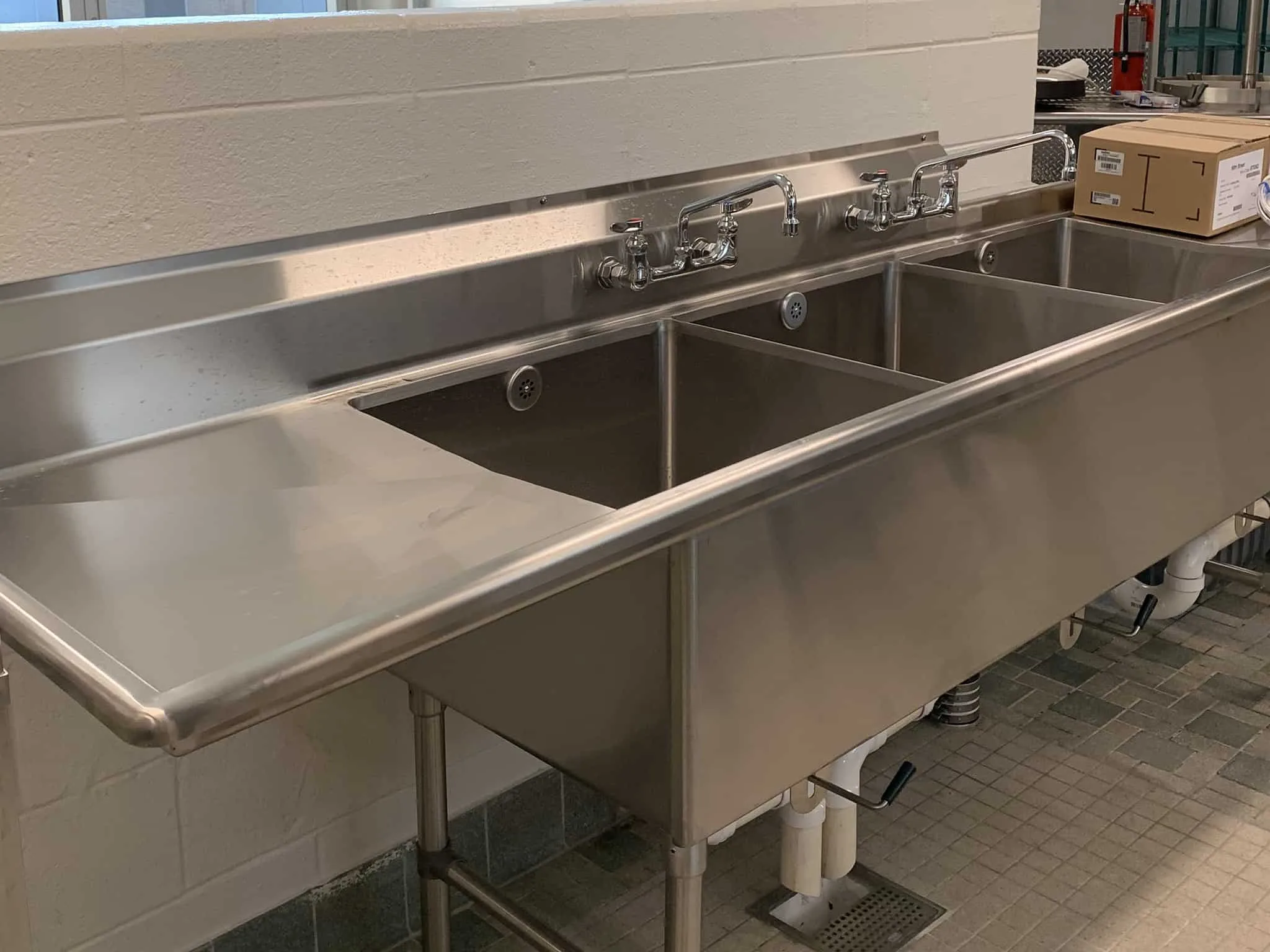 Stainless steel sink in a commercial restaurant kitchen